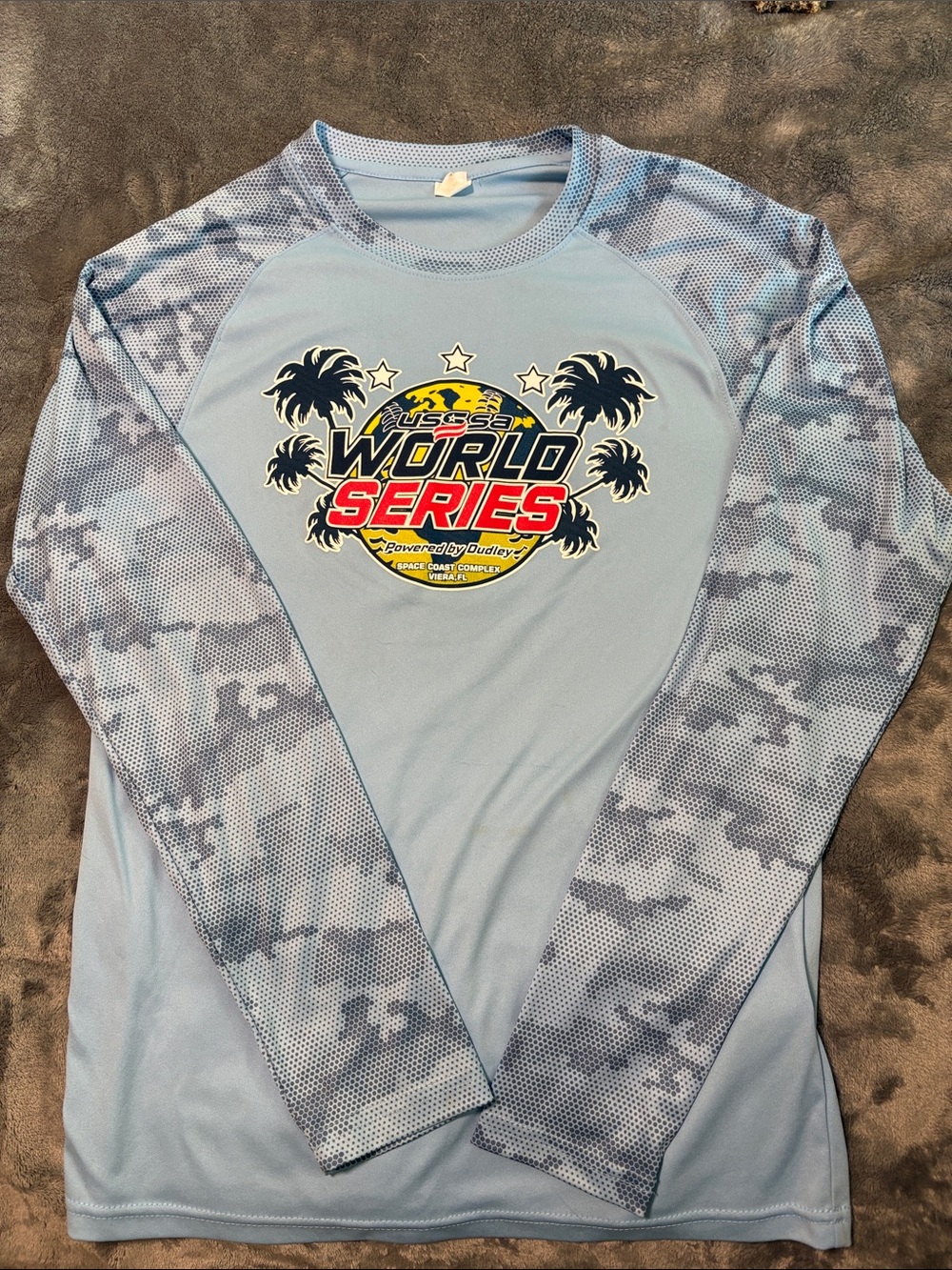 USSSA SOFTBAL WORLDS Light Blue Long-Sleeve Rash Guard with World Series Graphic